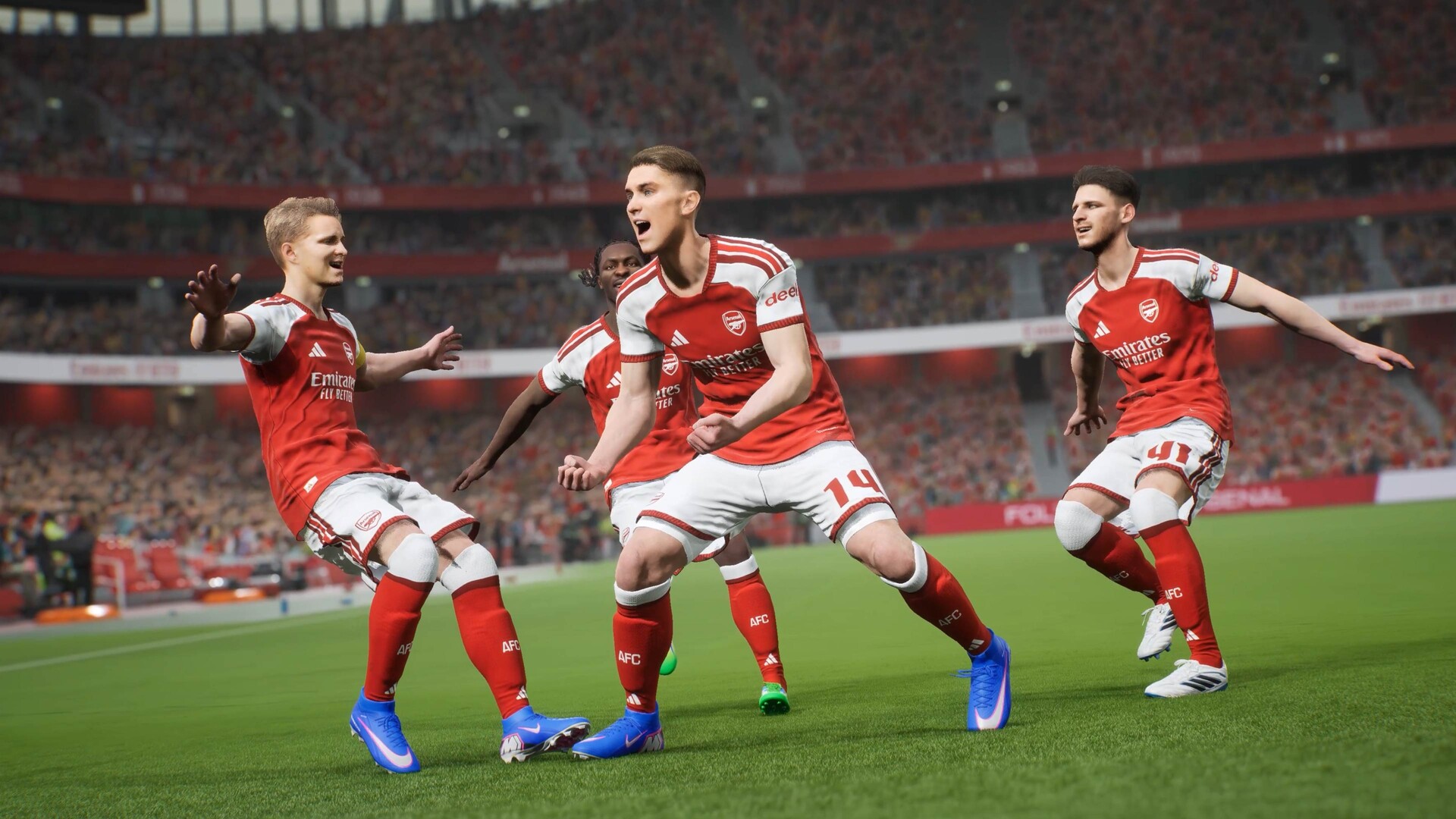 eFootballのゲーム画面。赤いユニフォームの選手たちがゴールを喜ぶ場面